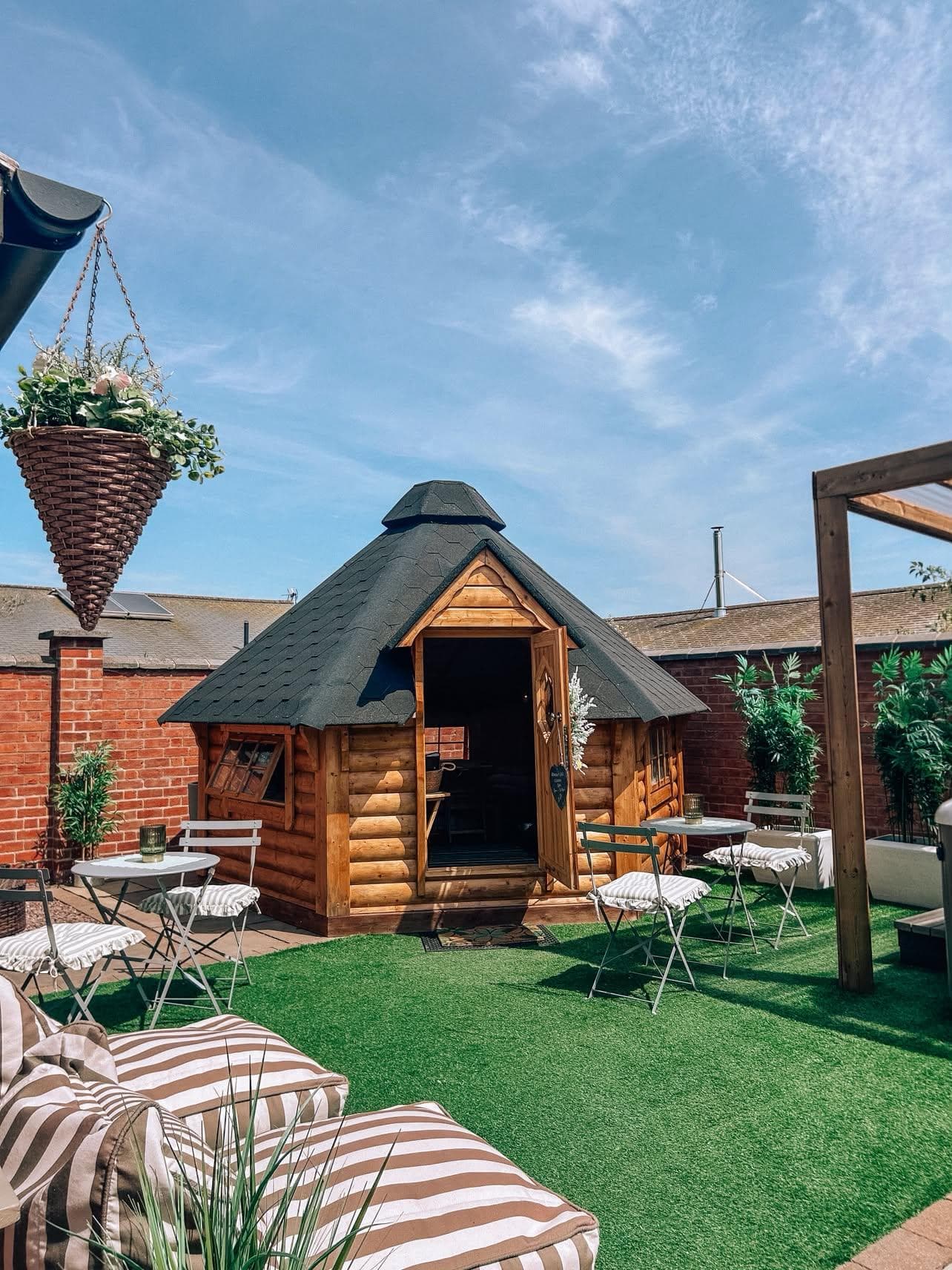 Private outdoor spa garden with bistro dining tables and sun loungers
